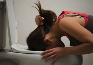 girl-vomits-in-toilet-